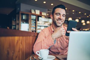Man on his phone smiling