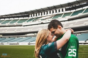 Jaclyn and Greg canoodling in their football gear.